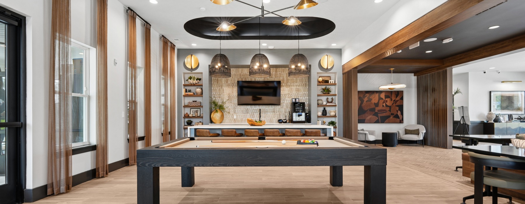 Clubroom with billiards and lounge seating at Clear Lake Vista