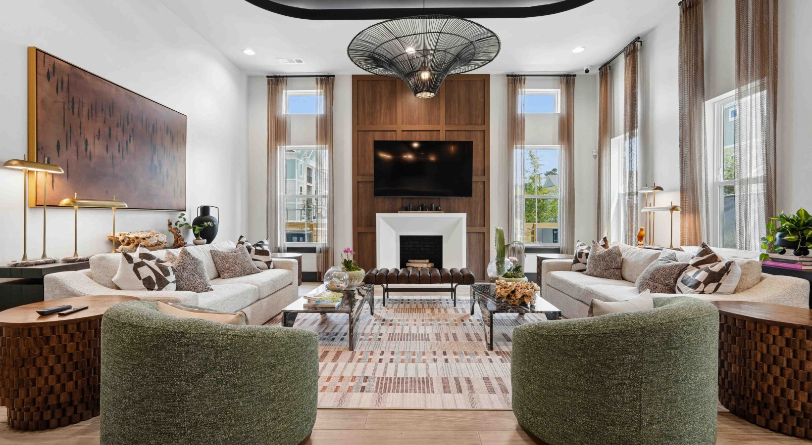a clubroom with a green couch and tables