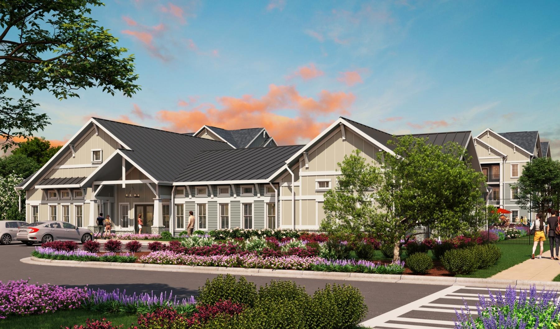 a large building with a garden in front of it