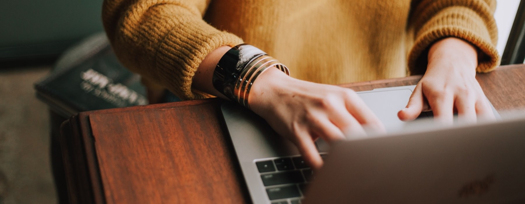 a person typing on a laptop