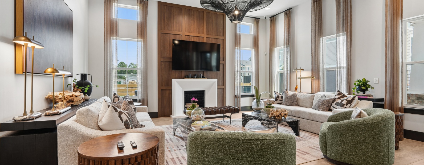 Clear Lake Vista resident lounge with fireplace and modern seating